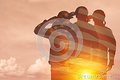 Silhouettes of soldiers with print of sunset and USA flag saluting on a background of light sky. Stock Photo