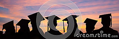 Silhouettes of students with graduate caps in a row on sunset background. Graduation ceremony web banner Stock Photo