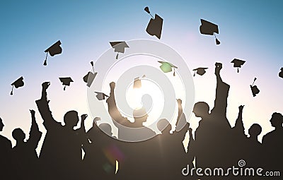 Silhouettes of students throwing mortarboards Stock Photo