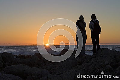 Silhouettes at Sunset Stock Photo