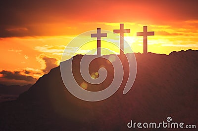 Silhouettes of three crosses at sunset on hill. Religion and christianity concept Stock Photo