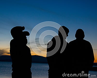 Silhouettes with Sunset Background Stock Photo