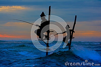 Silhouettes of the traditional Sri Lankan stilt fishermen Editorial Stock Photo