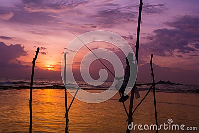 Silhouettes of the traditional Sri Lankan stilt fishermen Editorial Stock Photo