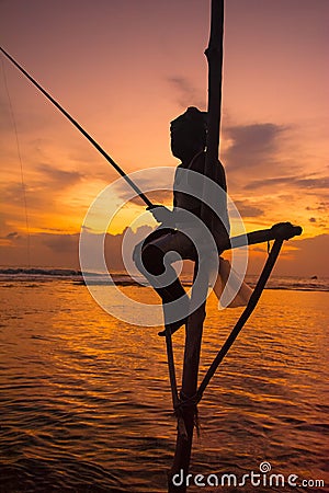 Silhouettes of the traditional Sri Lankan stilt fishermen Editorial Stock Photo