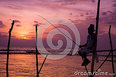 Silhouettes of the traditional Sri Lankan stilt fishermen Editorial Stock Photo