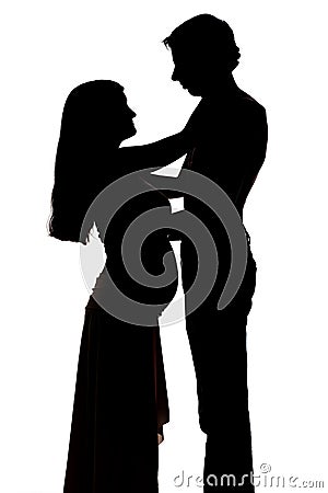 Silhouettes of two people men and a pregnant woman Stock Photo