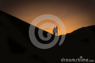 Silhouettes of two people Stock Photo