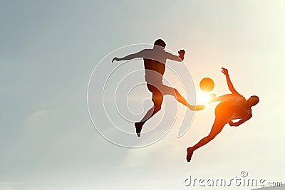 Silhouettes of two soccer players Stock Photo