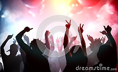 Silhouettes of young people dancing in club. Disco and party concept Stock Photo