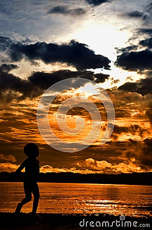 Silhoutte Wondama beach sunset 2 Stock Photo