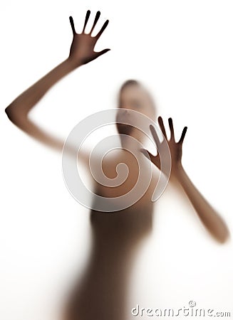 Silhuette of a screaming woman Stock Photo