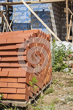 silicate bricks are stacked in pile on pallet and ready for construction Stock Photo