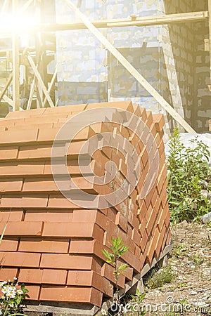 silicate bricks are stacked in pile on pallet and ready for construction Stock Photo