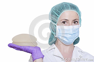 Silicone breast implants. Nurse holding implants. Doctor holding implants. Plastic surgery Stock Photo