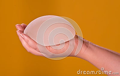 Silicone implants on hand Stock Photo