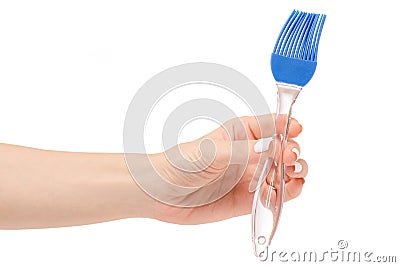 Silicone kitchen brush in hand Stock Photo