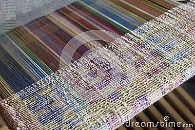 Silk weaving on a loom Stock Photo
