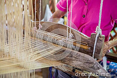 Silk weaving on loom Stock Photo