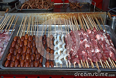 Silk worm and snake at Donghuamen Night Market, Beijing, China Stock Photo