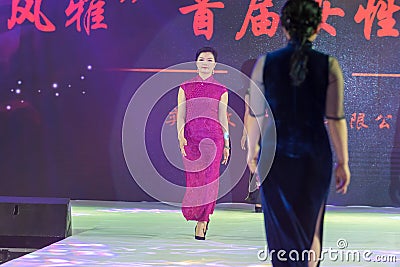 Silks and satin materials-Female cheongsam show Editorial Stock Photo