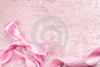 Silky satin plush pink backround with atlas pink bow and ribbon Stock Photo