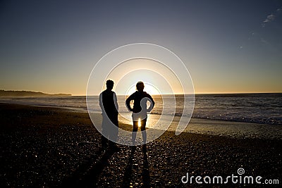 Sillouette People and Beach Stock Photo