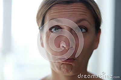 Silly facial expression, woman grimacing, close-up Stock Photo