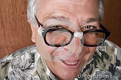 Silly Man with Taped Glasses Stock Photo