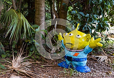 Silly Space Alien in the Tropical Jungle Garden Stock Photo