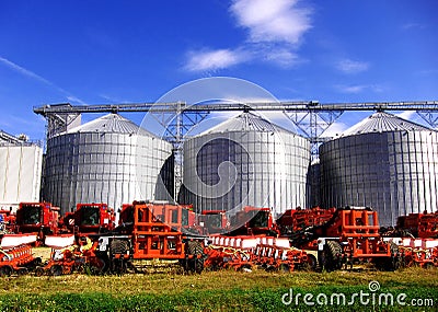 Silos and agricultural machinery Stock Photo