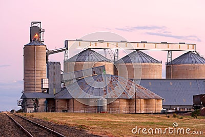 Silos bathed in pink after sunset light Stock Photo