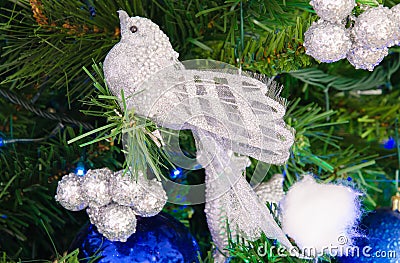 Silver bird decoration on christmas tree. Stock Photo