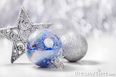 Silver and Blue Christmas ornaments on glitter bokeh background with space for text. Xmas and Happy New Year Stock Photo