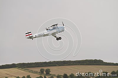 Silver and blue Tiger Moth on Fly past at Duxford aerodrome Editorial Stock Photo