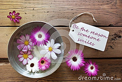 Silver Bowl With Cosmea Blossoms With Life Quote Be The Reason Someone Smiles Stock Photo