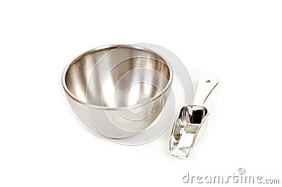 Silver bowl with measuring scoop Stock Photo