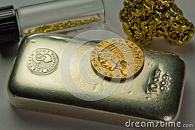 Silver Bullion Bar, Gold Coin and Gold Nuggets Stock Photo