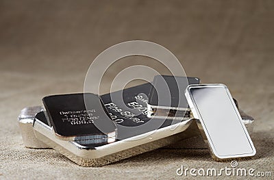 Silver bullion on a blurred background. Stock Photo