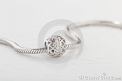 Silver charm bead with diamonds for chain bracelet Stock Photo