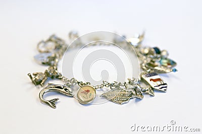 Silver charm bracelet Stock Photo