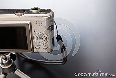 Silver compact digital photo camera. Stock Photo