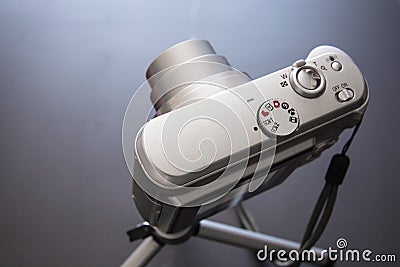 Silver compact digital photo camera. Stock Photo