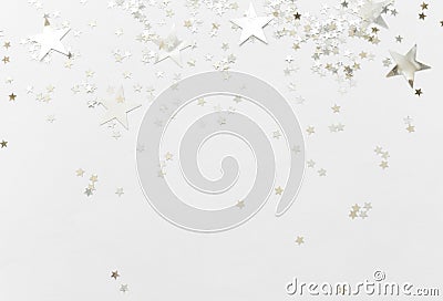 Silver confetti and stars and sparkles on a light background. Top view, flat lay. Copy text. holiday background. For Christmas, Stock Photo