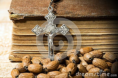 Silver Crucifix Rosary Bead and Holy Bible Stock Photo