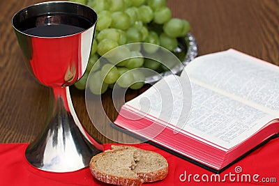 Silver cup , bread, grapes and bible Stock Photo