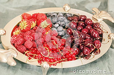 Silver dish with berries Stock Photo