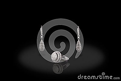Silver drop precious ring earrings with diamonds on black background. Stock Photo