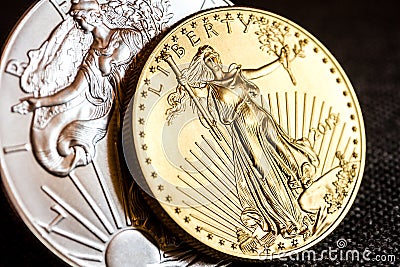 Silver eagle and golden american eagle one ounce coins Stock Photo