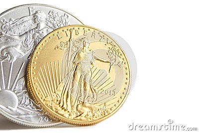 Silver eagle and golden american eagle one ounce coins Stock Photo